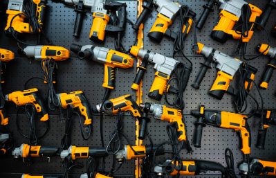 Many electric drills on the shelf