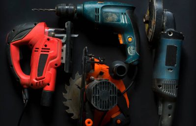 Hand power tools on a black background close-up.